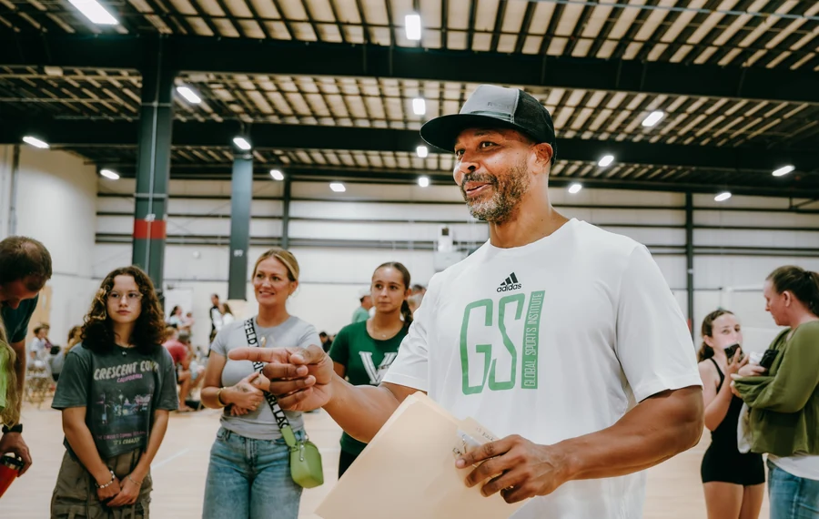 GSI coach guiding athletes and families during a volleyball session