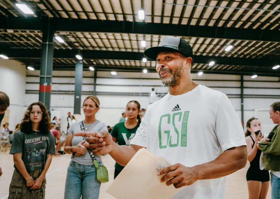 GSI coach guiding athletes and families during a training session