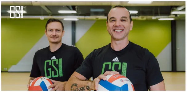 GSI volleyball coaching team in the gym