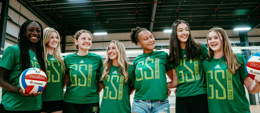 GSI club volleyball athletes together inside the training facility