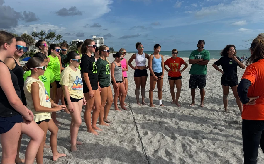 GSI beach volleyball athletes training together on sand