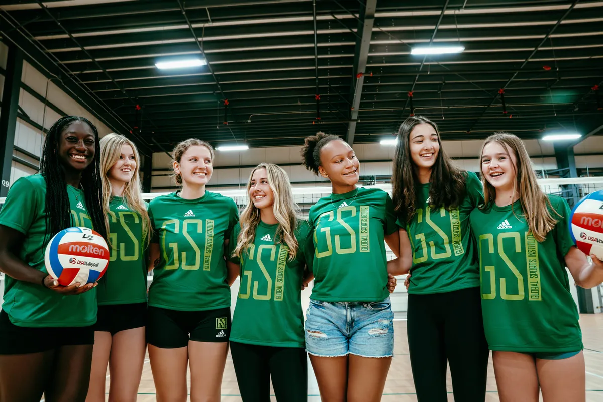 GSI volleyball athletes together inside the training facility